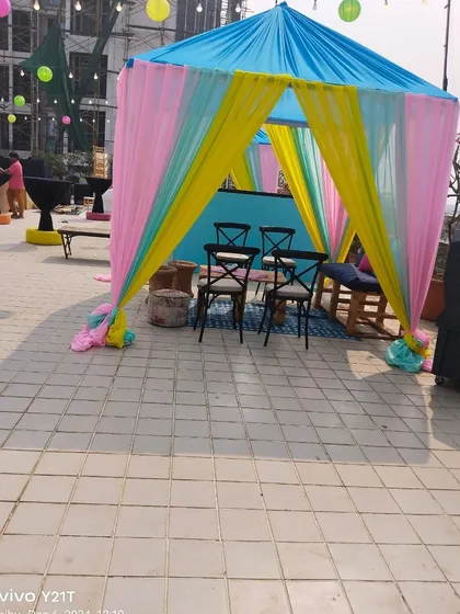 This colorful cabana was part of a terrace decoration we did in Bandra, Mumbai. The multi-colored drapes in pink, yellow, and blue create a vibrant and festive look for an outdoor pre-wedding party.