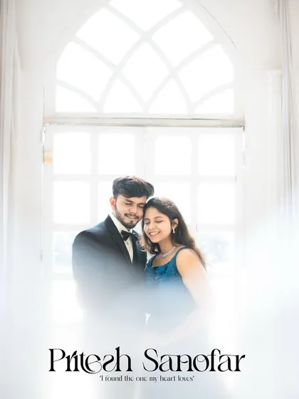 An ethereal, high-key portrait of a couple against a large arched window, creating a soft and dreamy effect.