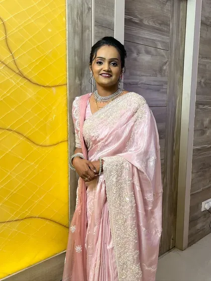 A happy, smiling bride ready for her reception party. The look is designed to be comfortable and long-lasting.