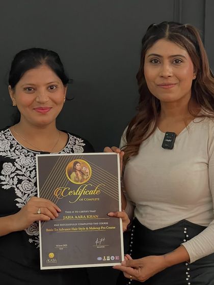 Presenting a certificate to Jaia Aara Khan. Every student who walks through my doors leaves with the skills to build a new life.