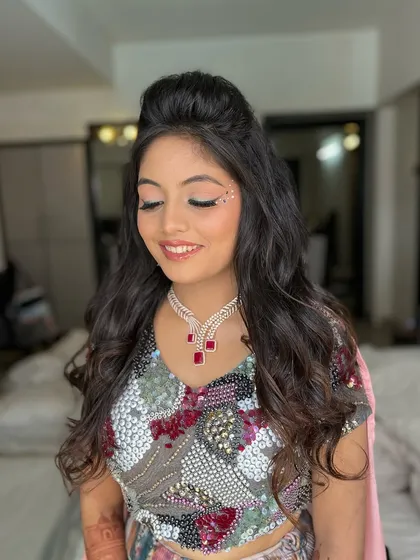 A happy and smiling client, ready for her carnival party. The makeup is designed to be both beautiful and expressive.