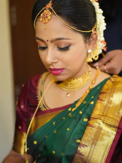 A close up of this stunning Tamil Iyer bride. I focused on creating sharp, defined eyes with a classic winged liner and a bold lip, a look that is both traditional and striking.