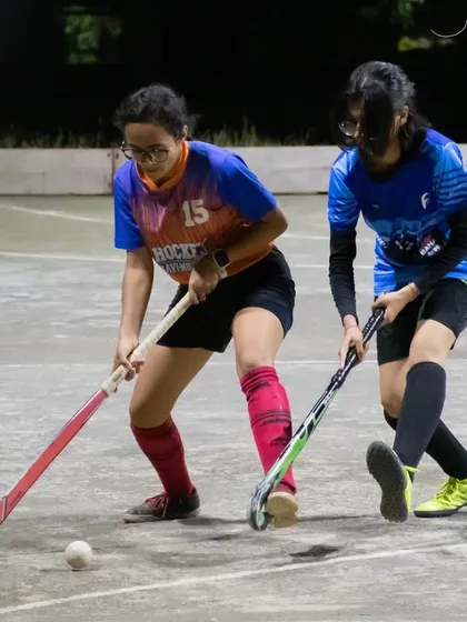 Two players in a one-on-one duel for the ball. These moments are crucial for developing individual skills and confidence.