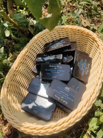 A basket full of our Blueberry Shizzle lip balms, back in stock and ready to go. The new plastic-free container is a win for you and the planet.