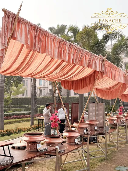 The catering setup, housed under canopies that match the event's color scheme.