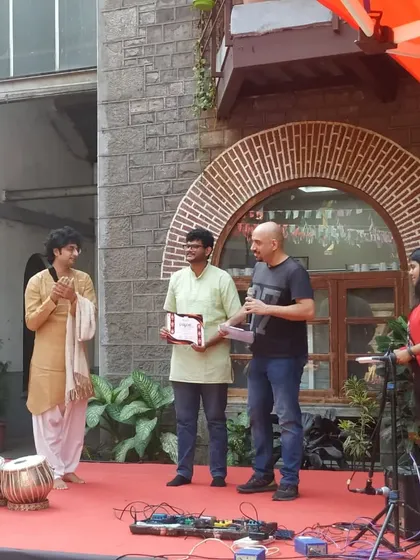 Applauding a student winner at the college festival. Encouraging young talent is a responsibility I hold dear.