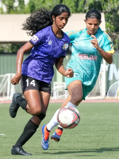 A tough battle for possession, showing the physical strength and determination of our players.