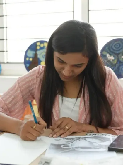 A student in our CFA program works on a detailed drawing, showcasing the advanced skills developed during the course.