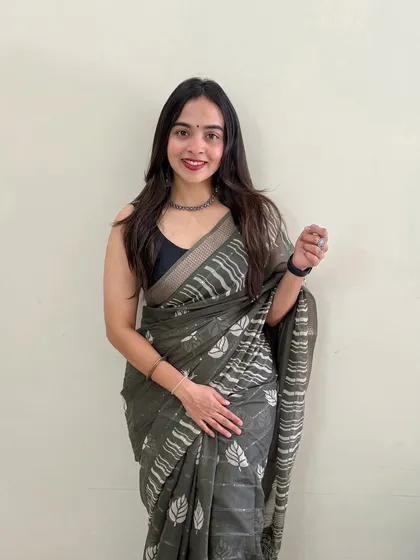 A simple and sweet look against a clean background. The makeup is minimal, with a focus on a radiant complexion and a pop of color on the lips.