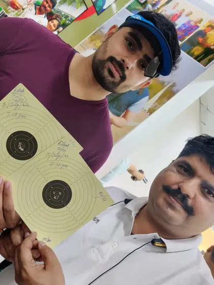 I am here with Rishabh Tyagi after he shot a perfect 100/100 in a practice session. Celebrating these milestones is an important part of our coaching process.