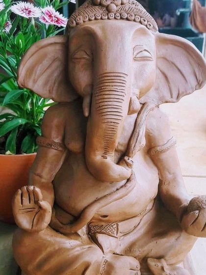 A beautiful, eco-friendly Ganesha idol in a meditative pose, ready to bring peace and blessings.