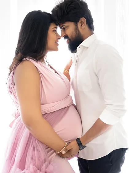 A beautiful and intimate close-up of an expecting couple, nose-to-nose, sharing a quiet moment of connection.