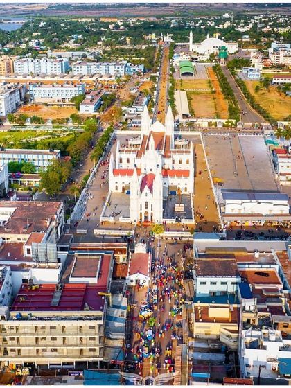 A slightly different aerial angle of the Vailankanni Basilica, capturing the procession and the scale of the pilgrimage site.