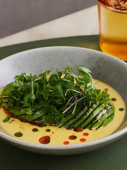 The Torched Avocado Ceviche, with its beautiful char marks and vibrant green herbs, ready to be served.