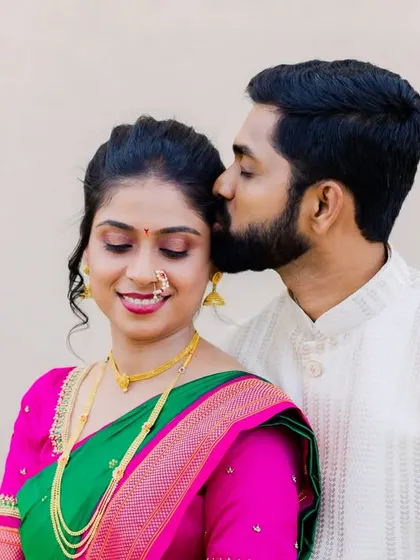 A sweet and gentle moment, with the groom giving his fiancée a kiss on the cheek. These are the tender memories you'll cherish forever.