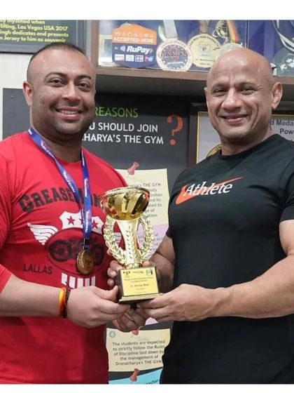 With my coach and my trophy. This success is not possible without the right guidance.