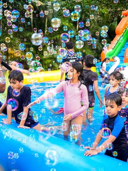 A bubble-filled pool scene with an entertainer leading the fun. This combination of activities ensures there's never a dull moment.