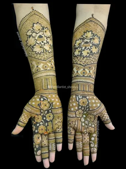 A gorgeous floral mehendi design. The use of dark-fill techniques makes the flowers pop, creating a striking look for any celebration.