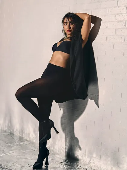 Bold and beautiful. This look for Khatija Iqbal features a wet-hair look, smokey eyes, and a strong pose, creating a powerful and modern image.