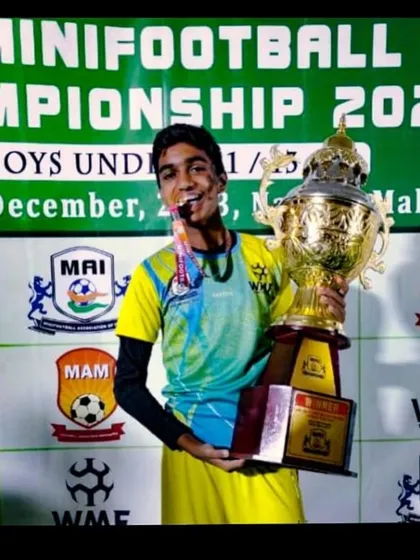 The sweet taste of victory. One of our players celebrates winning the Minifootball National Championship 2023.