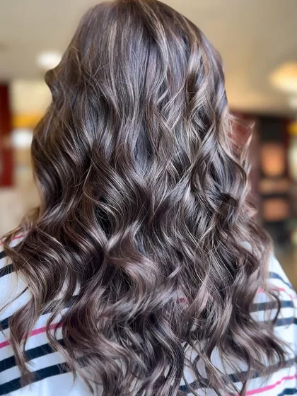 What do you think of this hair color? A beautiful example of a soft, wavy balayage with perfectly blended tones.