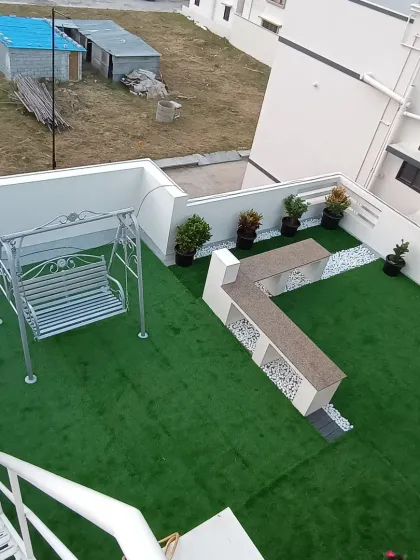 This is a complete rooftop transformation I completed, turning a bare terrace into a beautiful garden lounge. The project included installing pet-friendly artificial turf, a custom seating area, and a swing for relaxation.