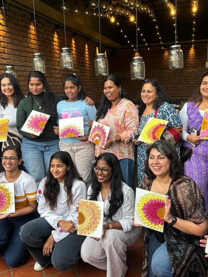 Another happy group showing off their sunflower-themed texture paintings.