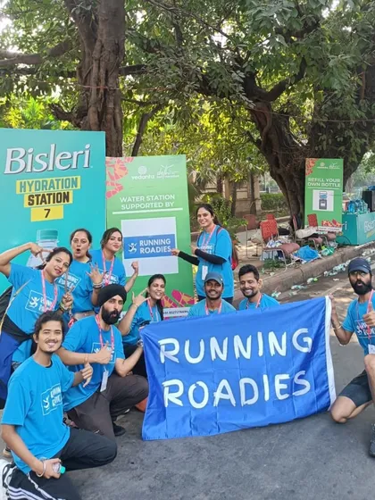 Our team posing at the Bisleri Hydration Station during the Delhi Half Marathon. We are experienced in managing official water stations for large-scale running events.