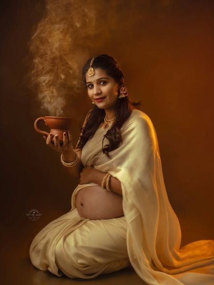 An artistic portrait featuring a mom-to-be holding a traditional vessel with fragrant smoke, adding a mystical and sacred feel to the image.