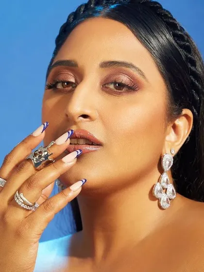 A close-up of the custom French nails with a twist that I created for Raja Kumari. The sharp blue tip perfectly matched her Marchesa gown.