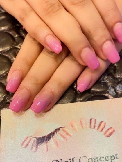 A bright and cheerful pink ombre on square-shaped nails. The color fades from a light pink at the base to a more vibrant shade at the tips.