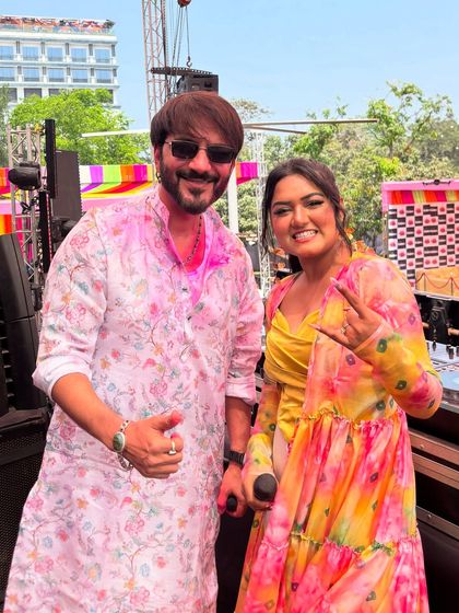 With DJ Ali Merchant at the Holi Hungama event. I work seamlessly with DJs and other artists to ensure the event's entertainment is perfectly coordinated.