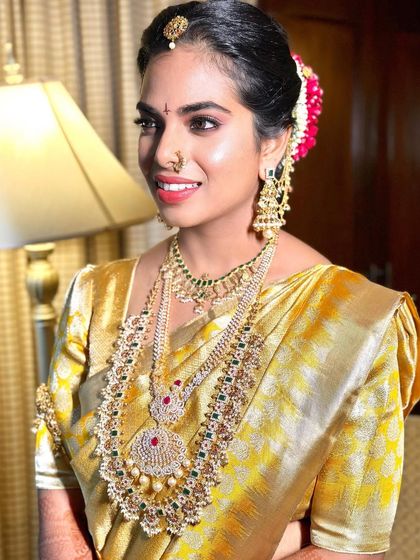 A close-up of the South Indian bride, showcasing the bright, beautiful smile and the makeup that enhances her features perfectly.