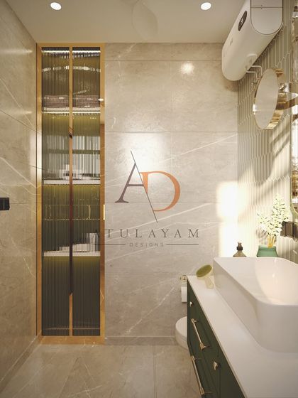 A view of the bathroom's storage solution: a tall, fluted glass cabinet with gold trim, providing elegant and concealed storage.