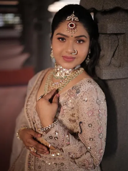 A close-up on the blouse and jewelry with this pastel lehenga. The details make the whole look come together perfectly.