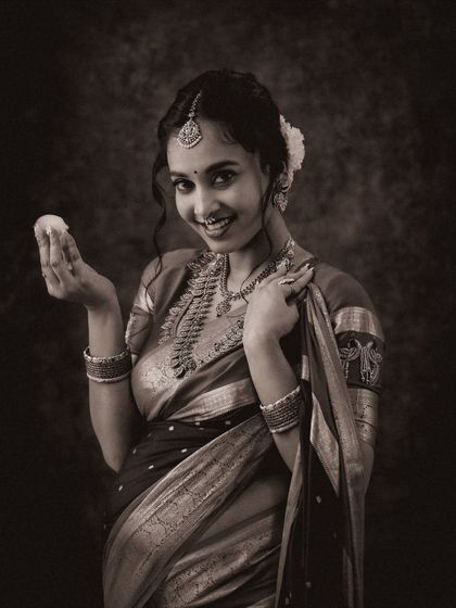 A classic black and white version of a traditional portrait. The monochrome effect adds a timeless and artistic quality, focusing on expression and texture.