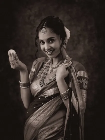 A classic black and white version of a traditional portrait. The monochrome effect adds a timeless and artistic quality, focusing on expression and texture.