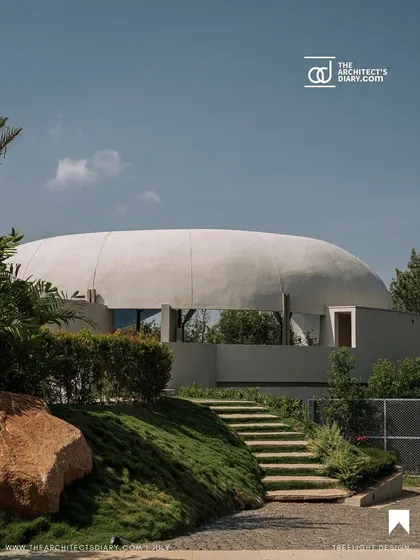 This image, featured in The Architect's Diary, shows the rear view of the Aqua project, revealing its dome-like structure and integration with the terraced landscape.