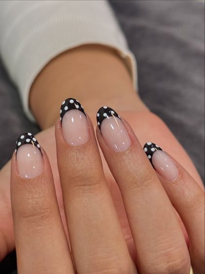 Another shot of the adorable polka dot French tips. This design is perfect for someone who wants a fun yet classic look.