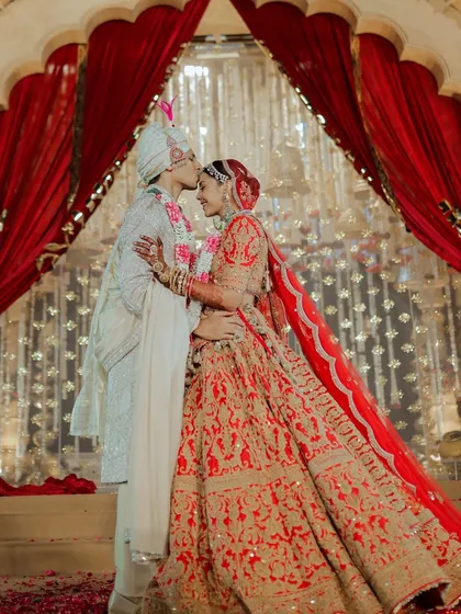 Amidst the grandeur, it's these quiet moments of love that truly define a wedding. A gentle kiss, a shared smile, framed by a royal backdrop, this is the kind of timeless romance I strive to create for my couples.