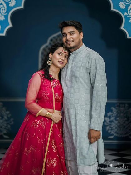 A classic couple portrait. The makeup is flawless and well-balanced, ensuring both partners look their best.