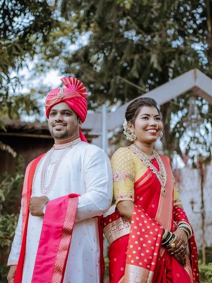 A classic portrait of the couple in their wedding attire. Their happy, relaxed expressions are captured against a lovely outdoor backdrop, making for a perfect memory. (Duplicate of 43)