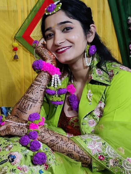 A complete floral crochet jewelry set I created for a bride's mehndi ceremony. The vibrant purple and pink flowers are paired with pearls to create a stunning and unique look.