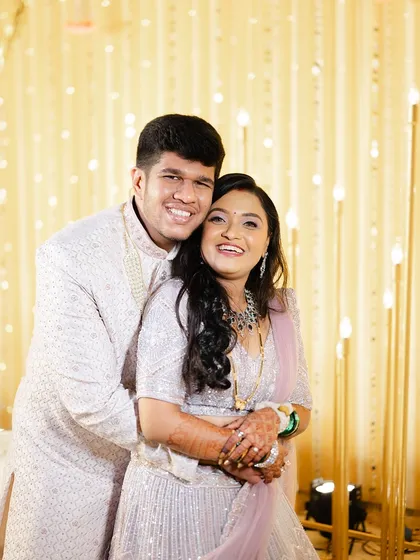 A happy, hugging portrait of the couple, their smiles reflecting their love for each other.