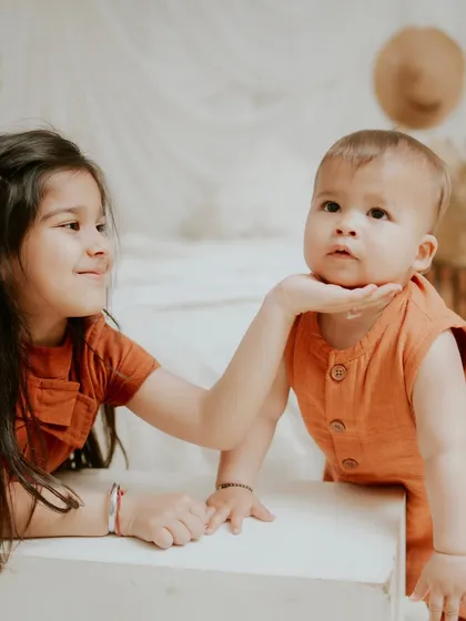 A protective and loving gesture from big sister. These are the moments that show the depth of their bond.