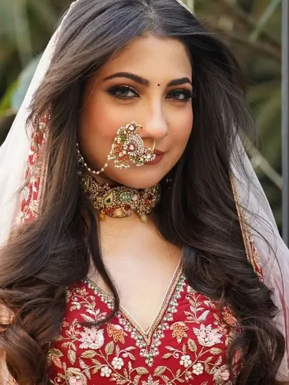 A bride's look is a collection of beautiful details. This Rajwadi-style bridal nose ring, or nath, is handcrafted with intricate details to bring a touch of royal tradition and complete the bridal ensemble.