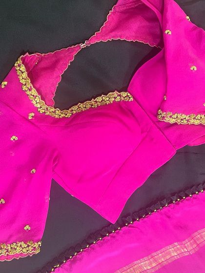 The full view of the pink georgette blouse laid over its matching Mysore silk saree, showing the complete, elegant ensemble.