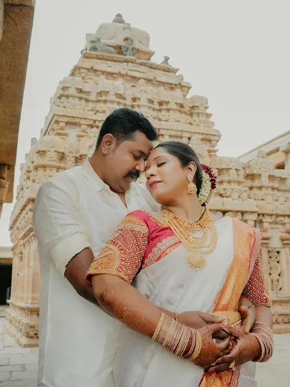 A serene pre-wedding portrait session against the timeless architecture of a South Indian temple. I love finding unique backdrops that add a sense of grandeur and history to your love story, creating truly epic and romantic photographs.