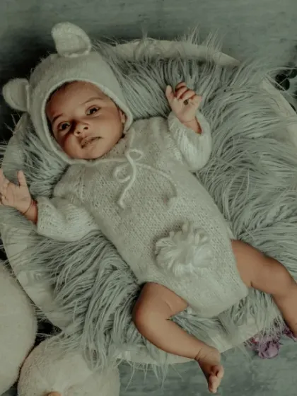 Our little bear cub. This awake and expressive shot shows that even our themed outfits are comfortable enough for your baby to wiggle and smile in.