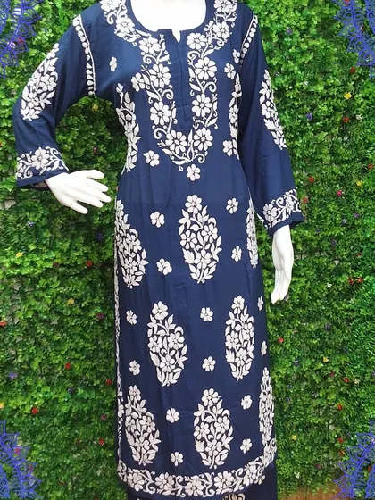 Another look at our navy blue Chikankari kurti. The detailed embroidery on the sleeves and the front panel showcases the beautiful craftsmanship of Lucknowi artisans.